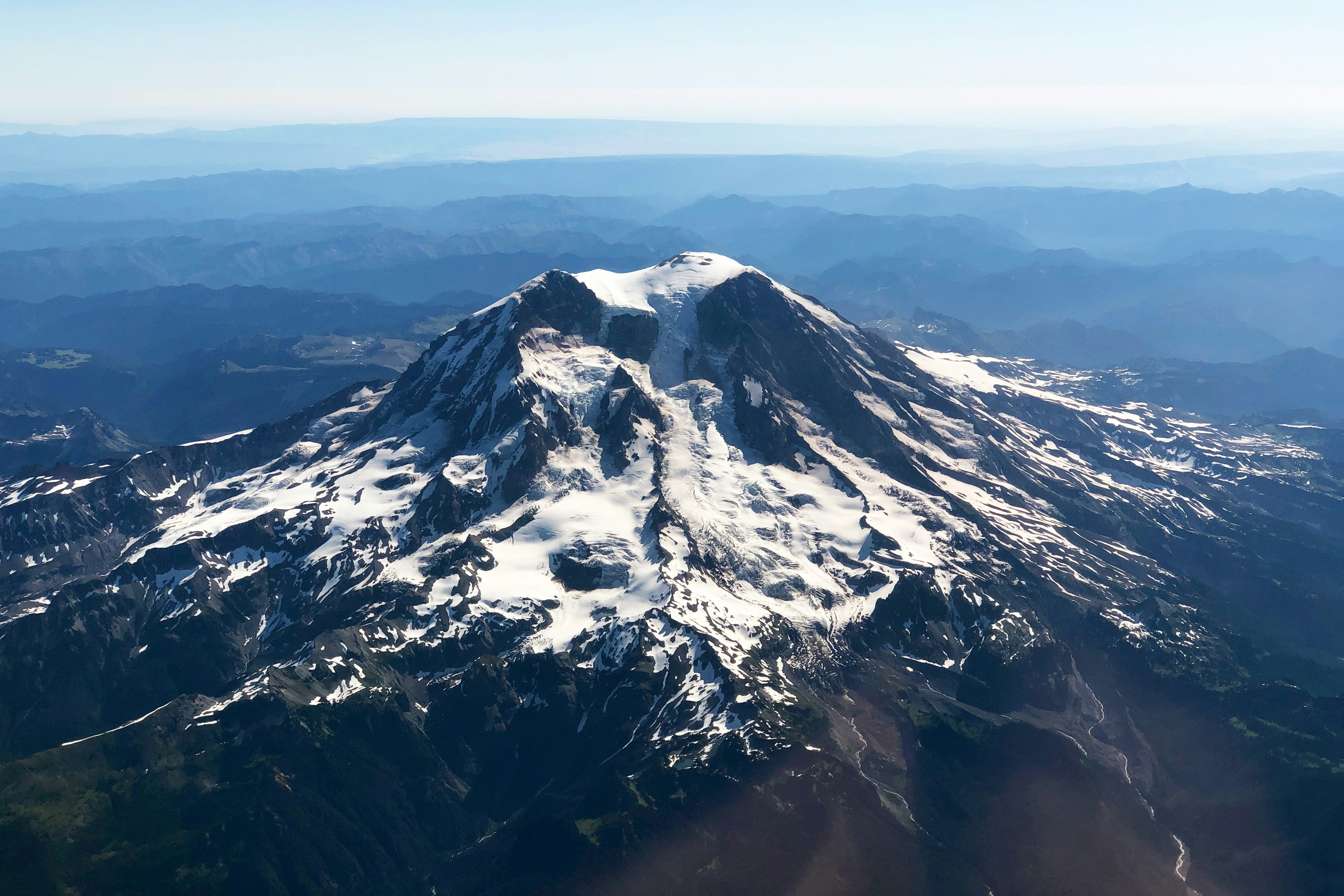 black and white mountain under blue sky during daytime, Mount Rainier from Airplane