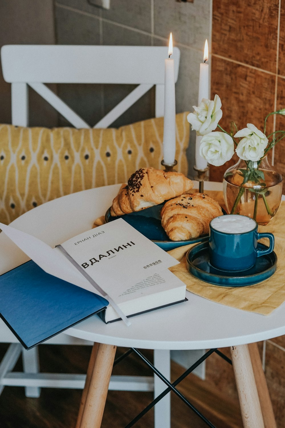 blue ceramic mug on white ceramic plate