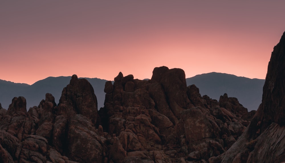 brown rock formation during sunset