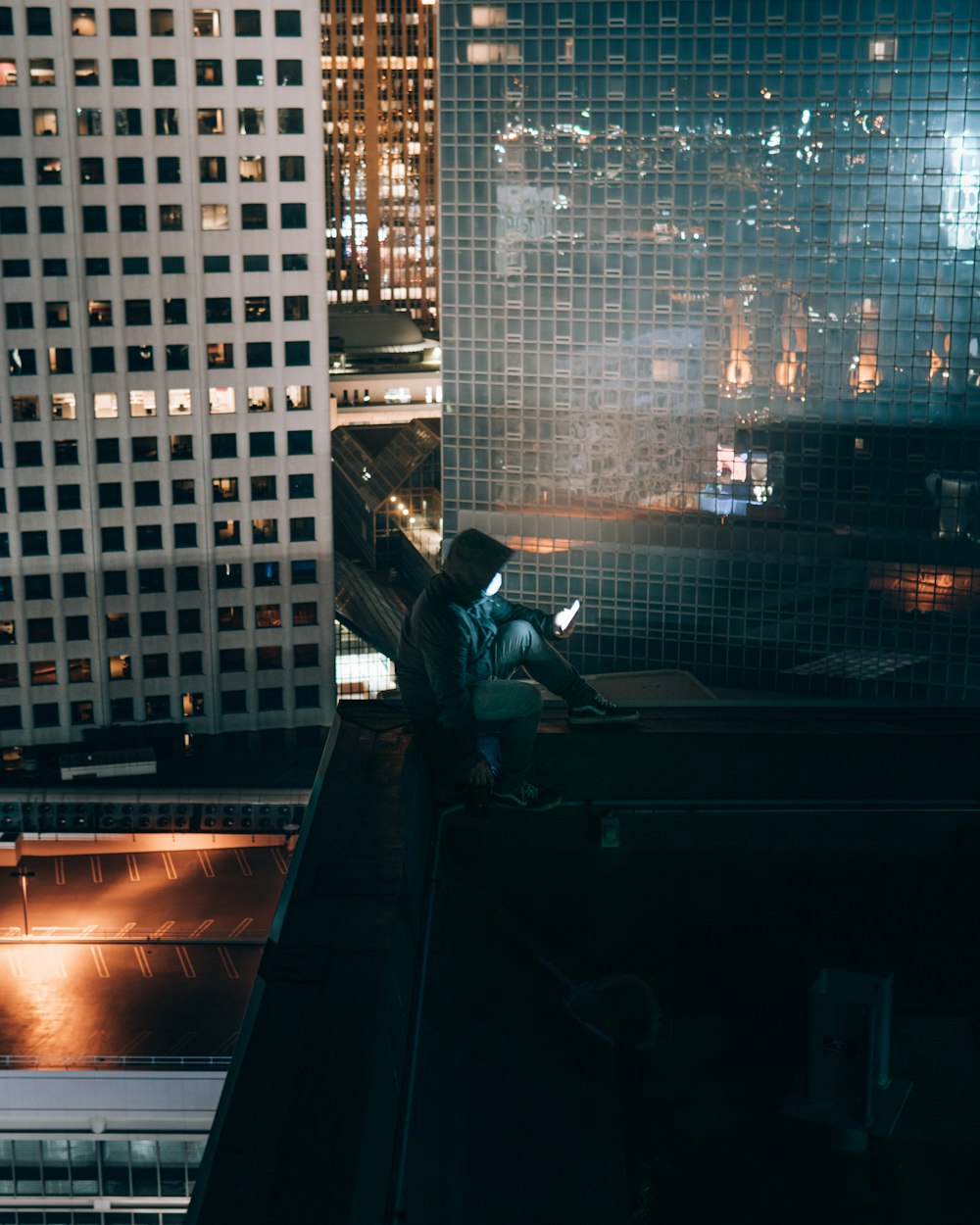 man in black jacket sitting on black chair