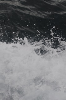 Animated water waves clashing gently, symbolizing the Black Seas Communications brand.