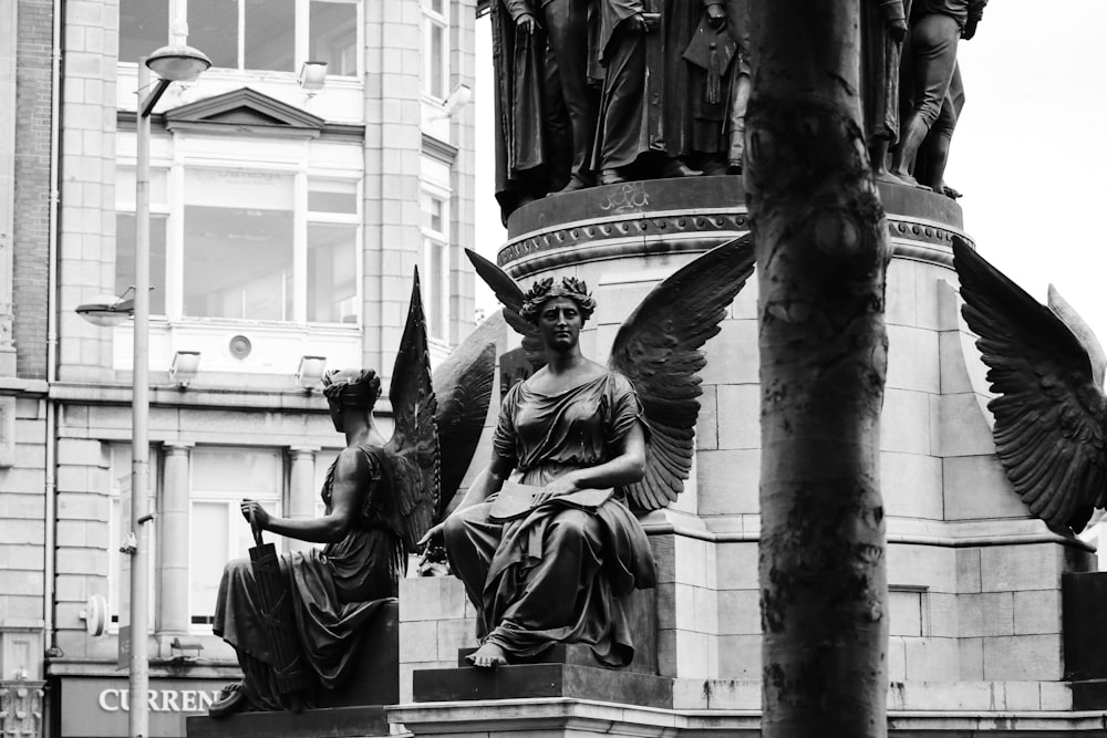 grayscale photo of statue of man