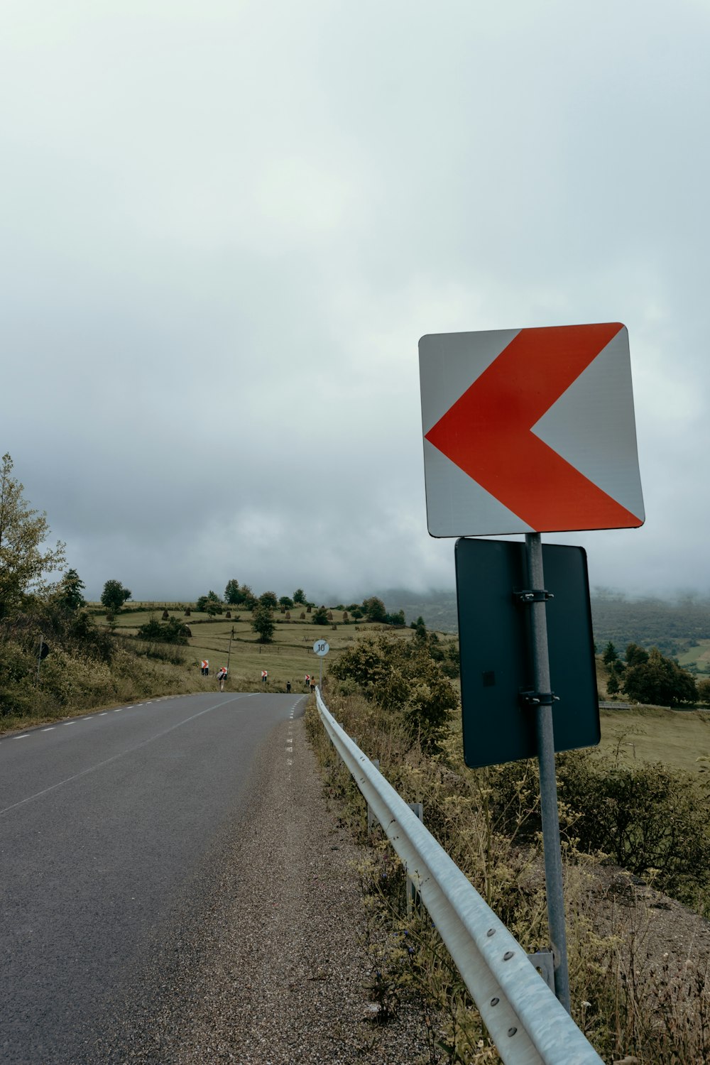 red and black road sign