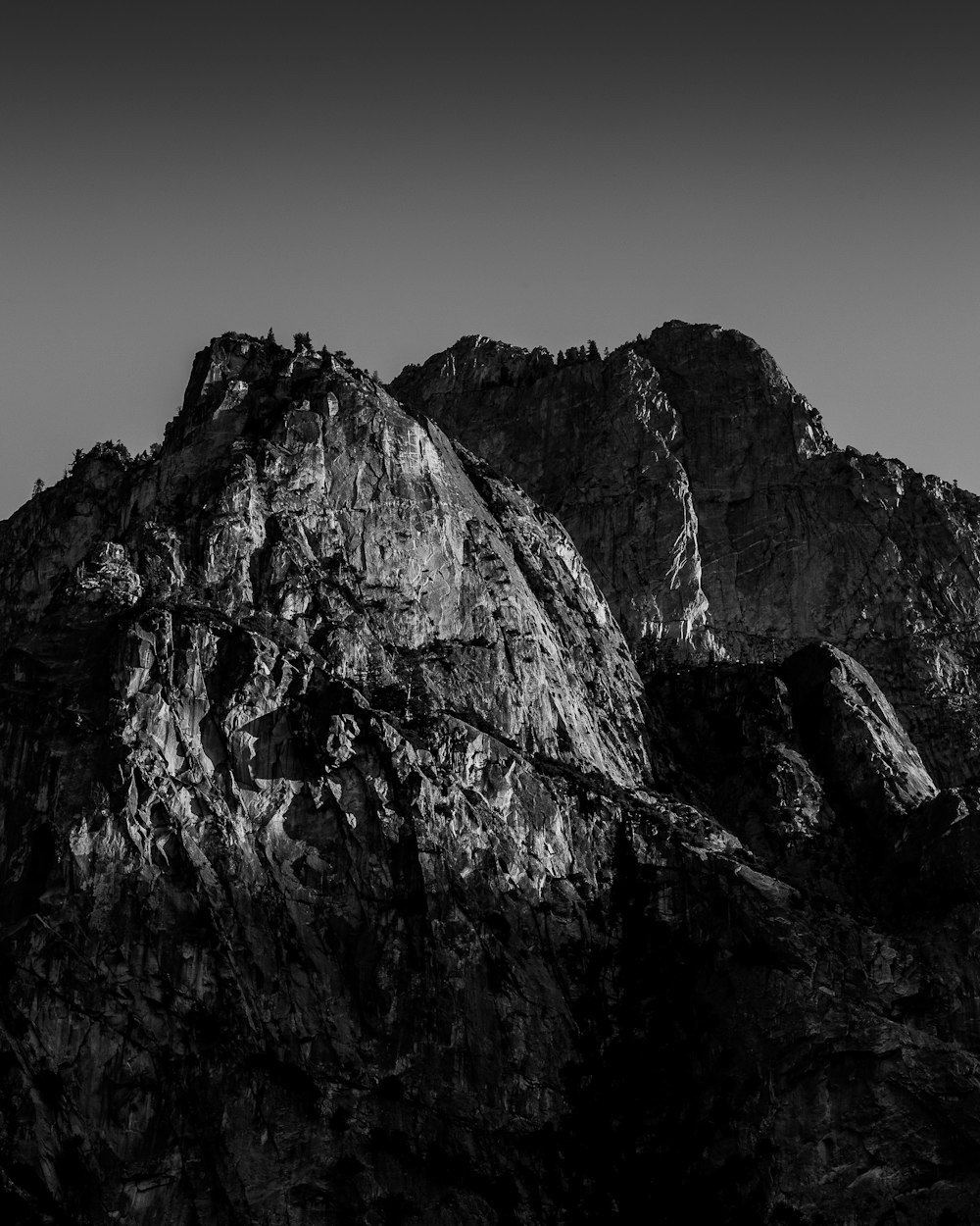 grayscale photo of rocky mountain