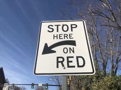 Close-up of a traffic sign with clear regulatory instructions on a city street.