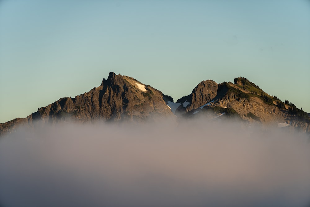 brown rocky mountain under white sky during daytime