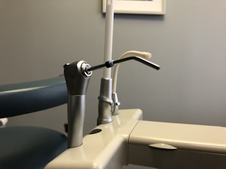 stainless steel faucet on white ceramic sink