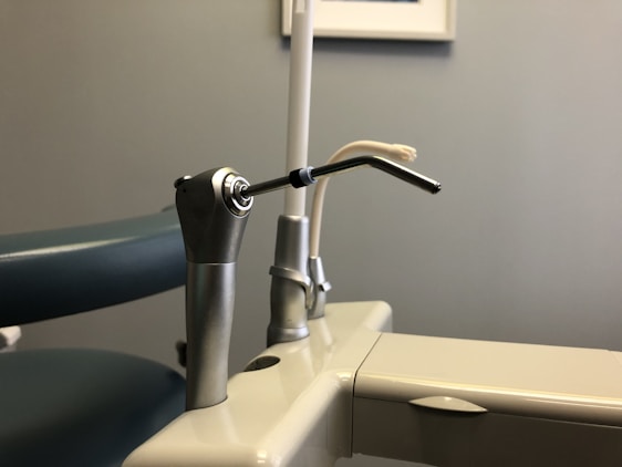 stainless steel faucet on white ceramic sink