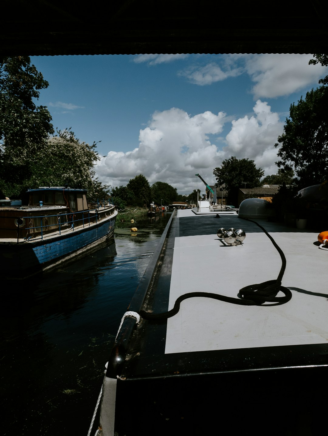 blue and white boat on dock during daytime