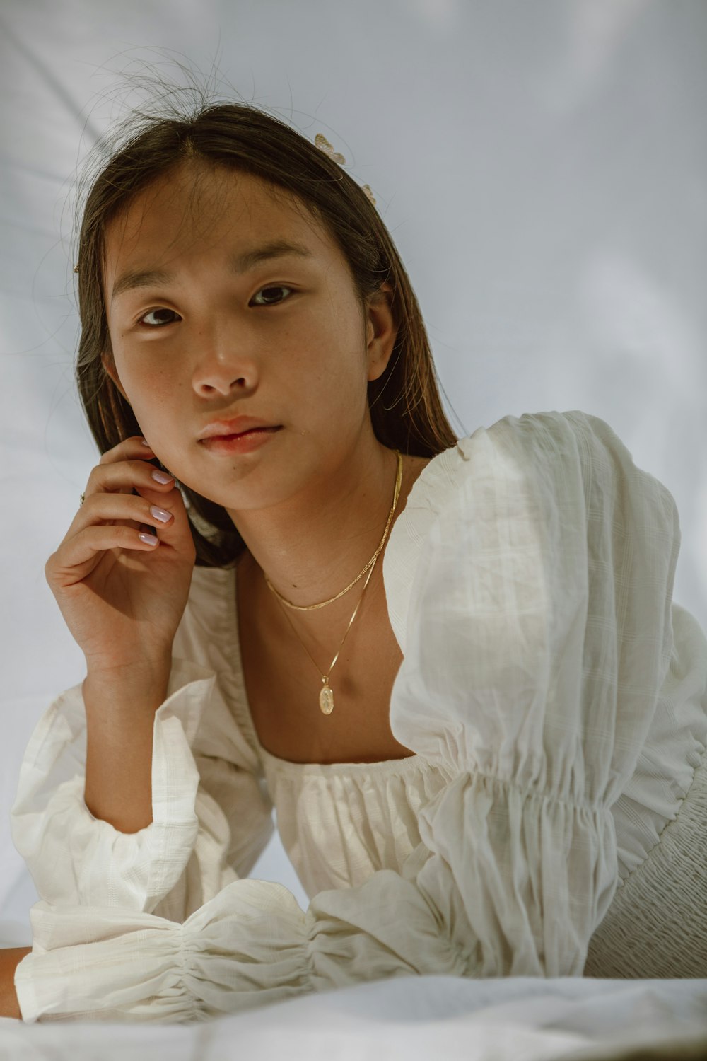 woman in white long sleeve shirt