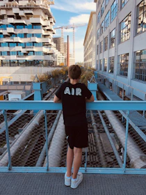 A civil engineer examining structural blueprints against the backdrop of modern Istanbul skyscrapers.