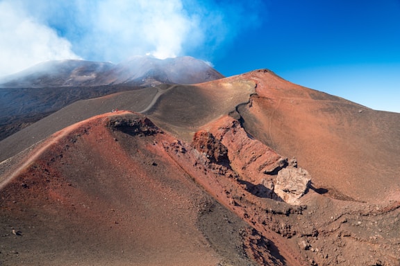 brown mountain under blue sky during daytime