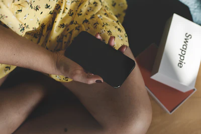 person holding black android smartphone
