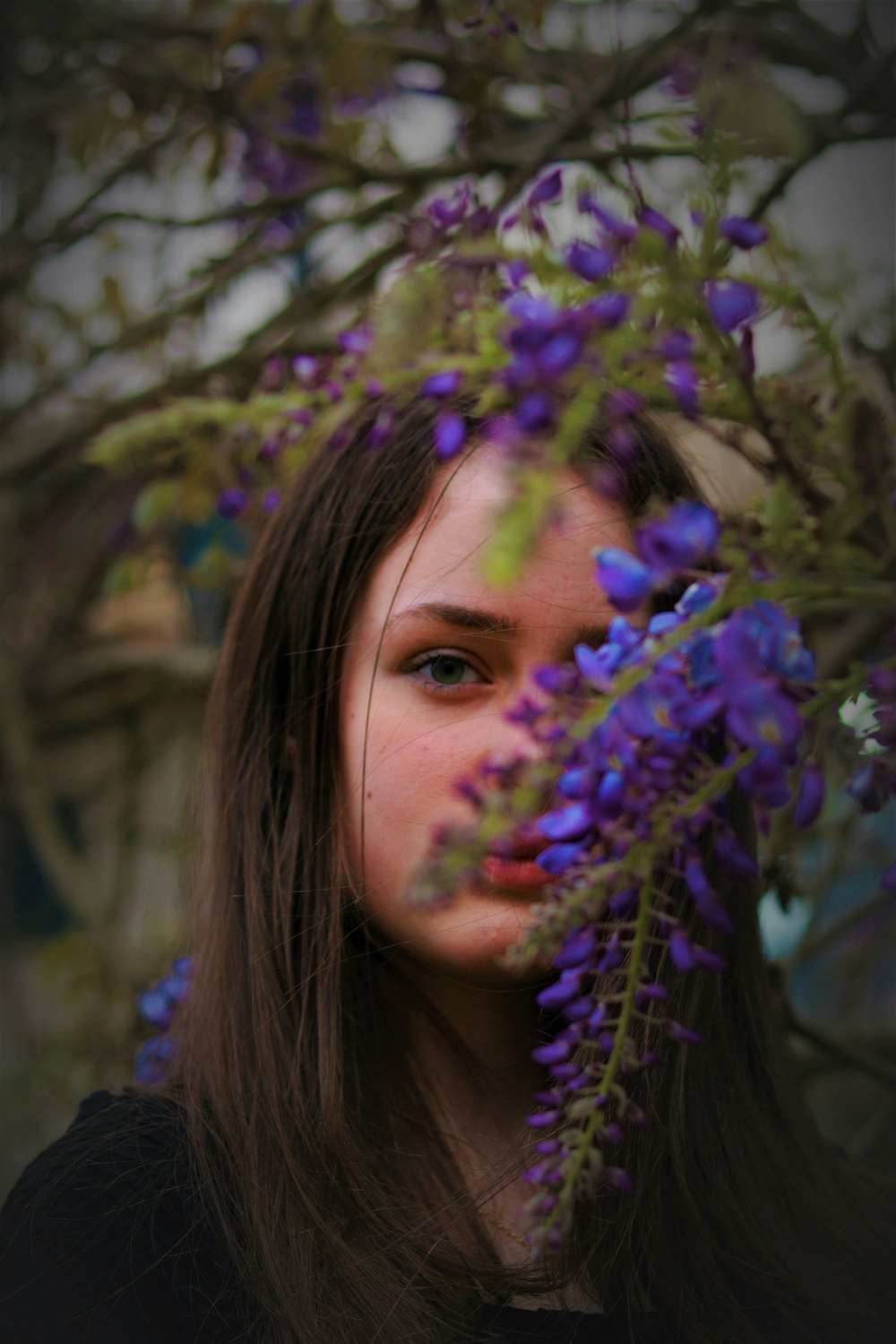 girl with purple flower on her head