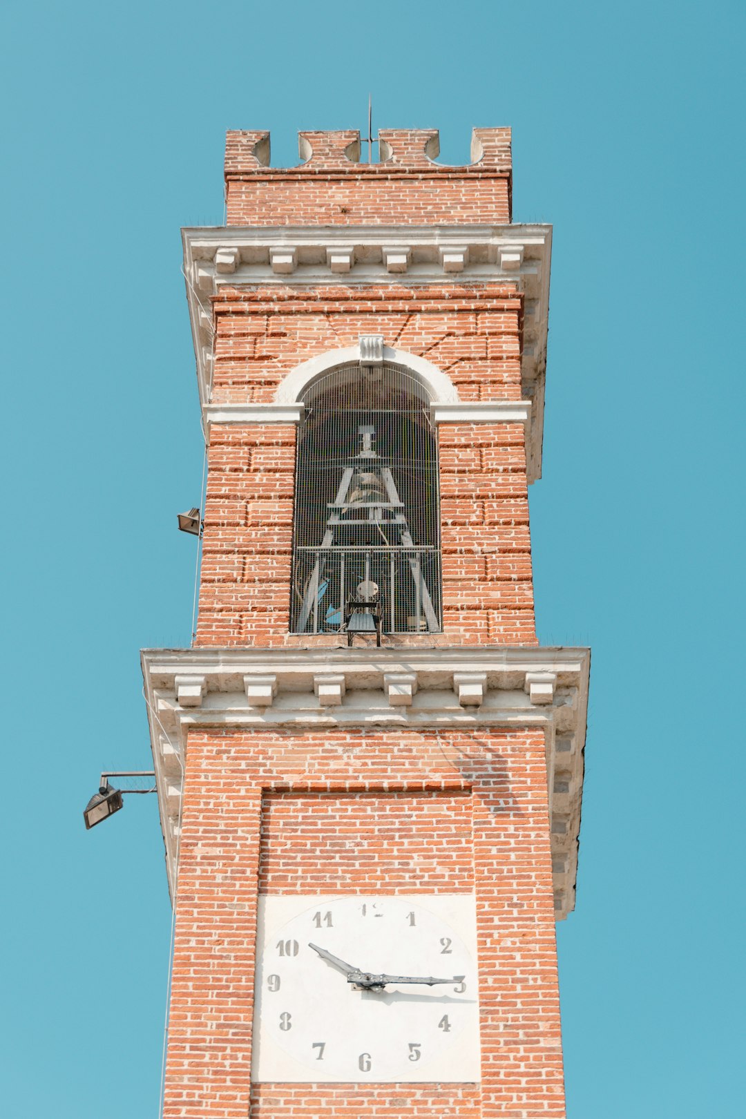 brown brick tower under blue sky during daytime