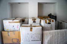 brown cardboard boxes on brown wooden table
