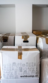 brown cardboard boxes on brown wooden table