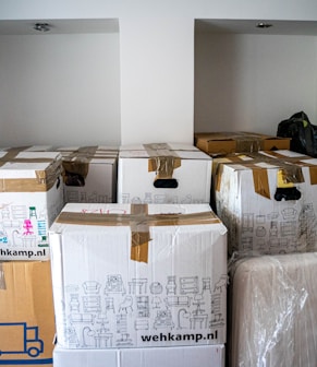 brown cardboard boxes on brown wooden table