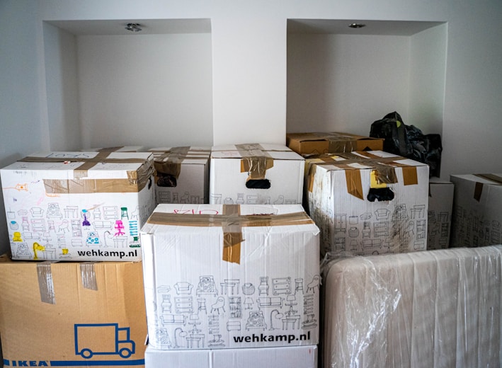 brown cardboard boxes on brown wooden table