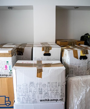 brown cardboard boxes on brown wooden table