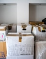 brown cardboard boxes on brown wooden table