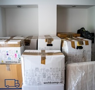 brown cardboard boxes on brown wooden table