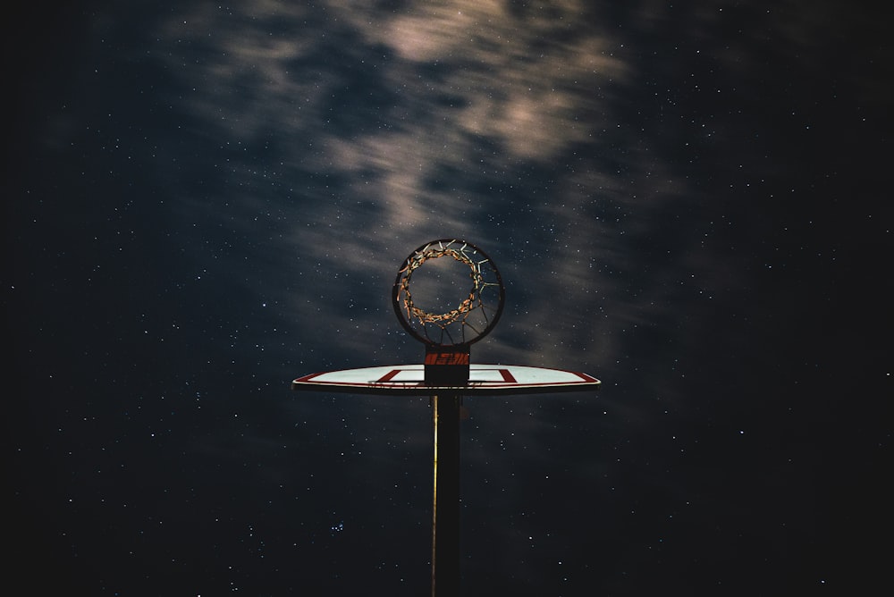 white and red satellite under cloudy sky