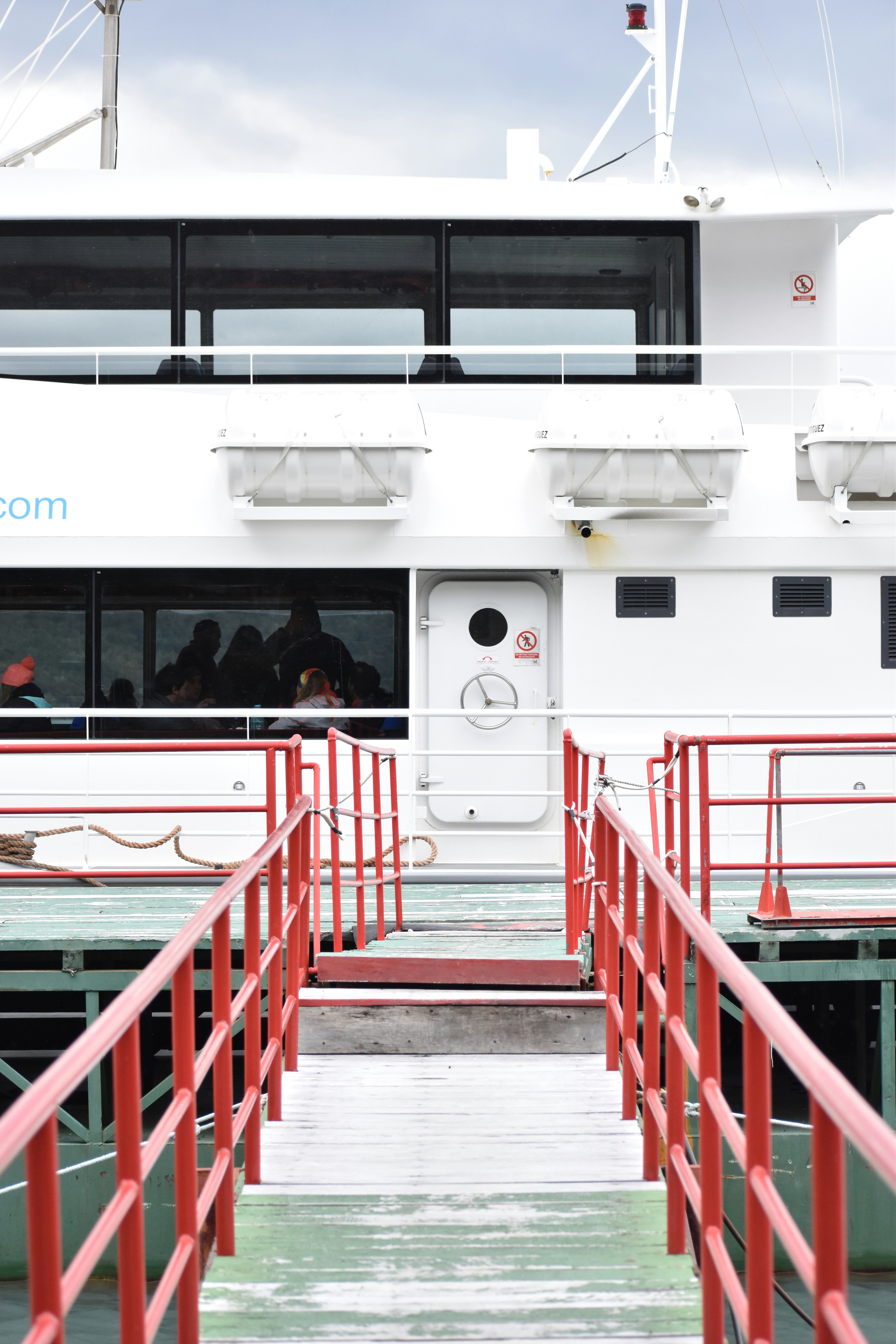 people walking on stairs near white building during daytime