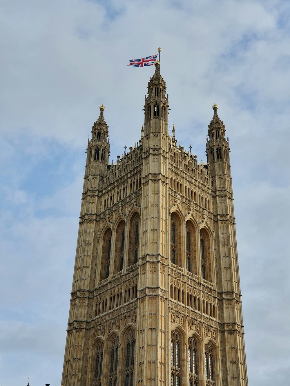 brown concrete building with flag of us a on top