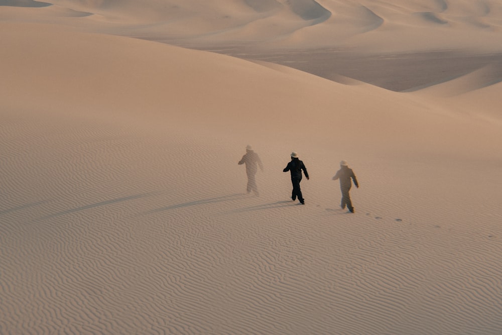 people walking on white sand during daytime