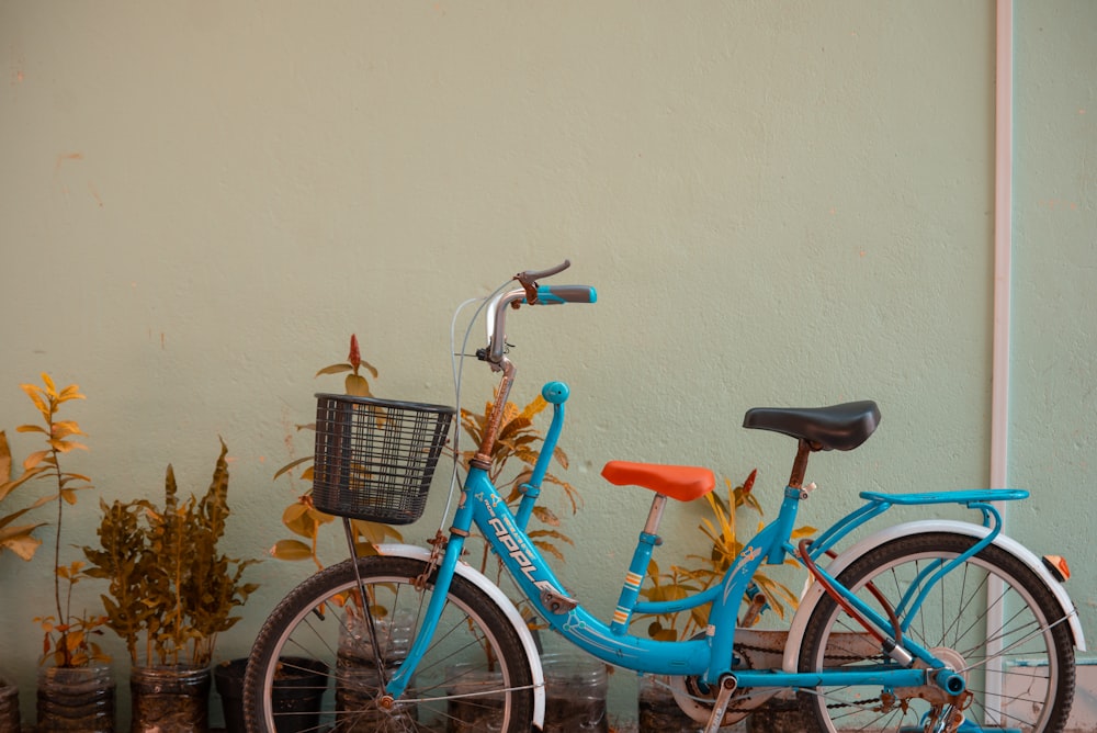 blue city bike with basket on top