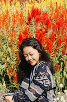 A person enjoying a peaceful moment in a garden surrounded by greenery.