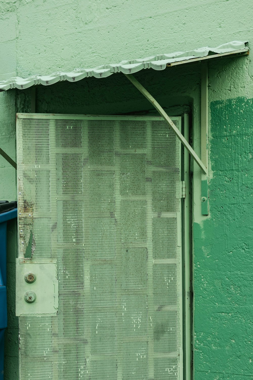 green and white wooden door