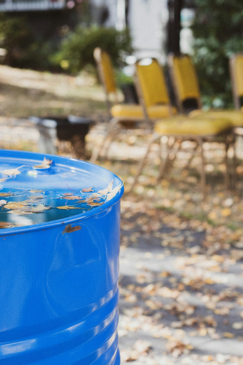 blue plastic bucket on brown wooden table