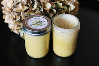 Elegant glass jars filled with CBD-infused creams and balms