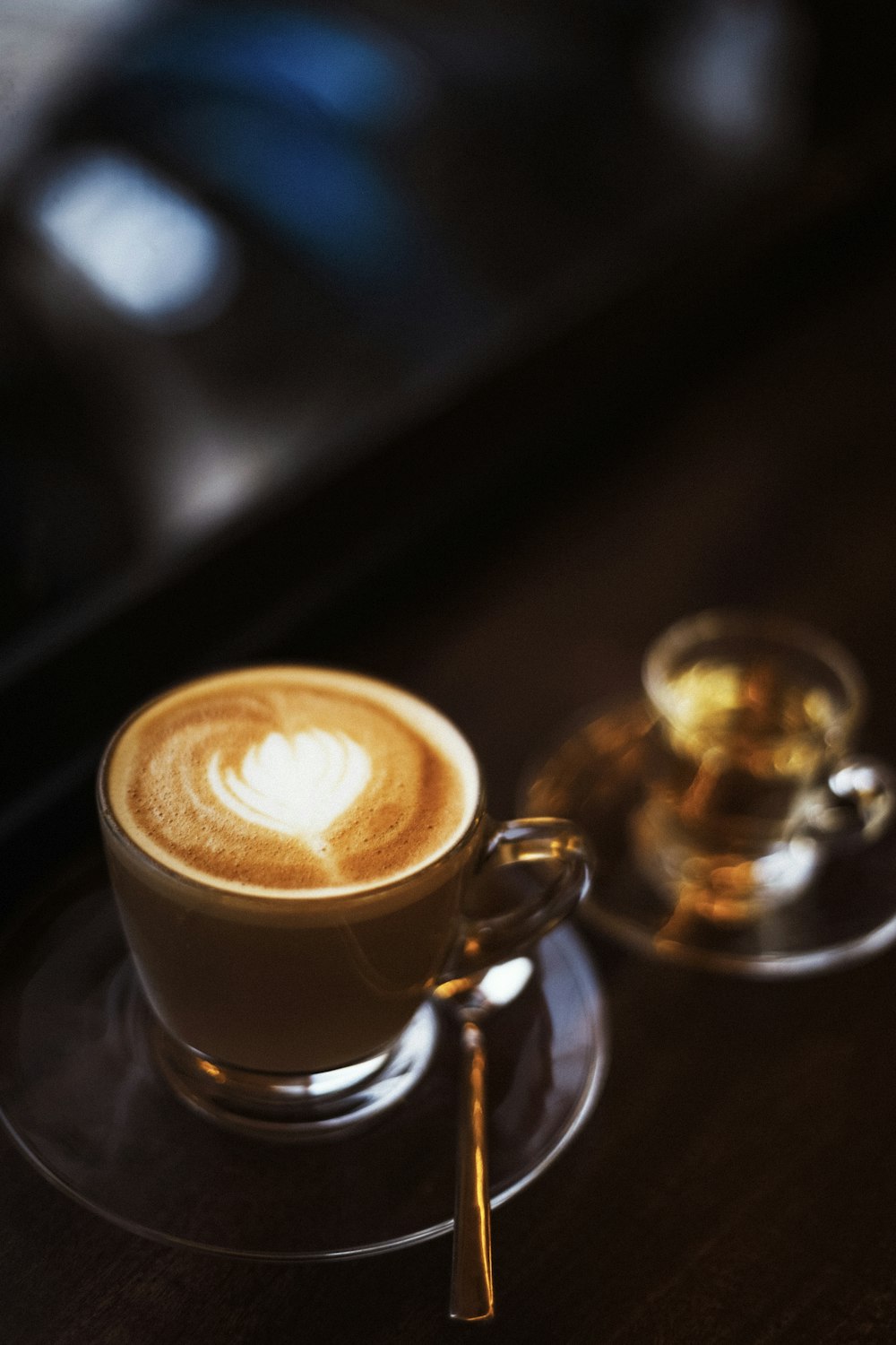 clear glass mug with coffee