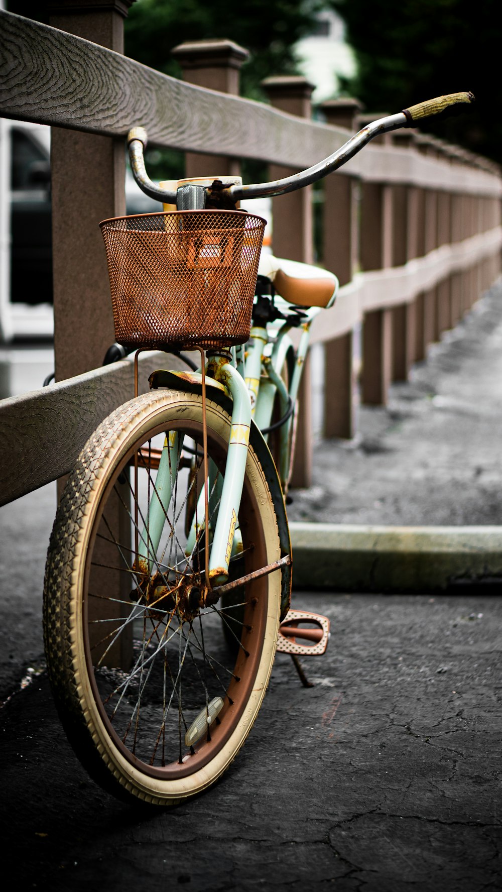 brown city bike on gray concrete road during daytime