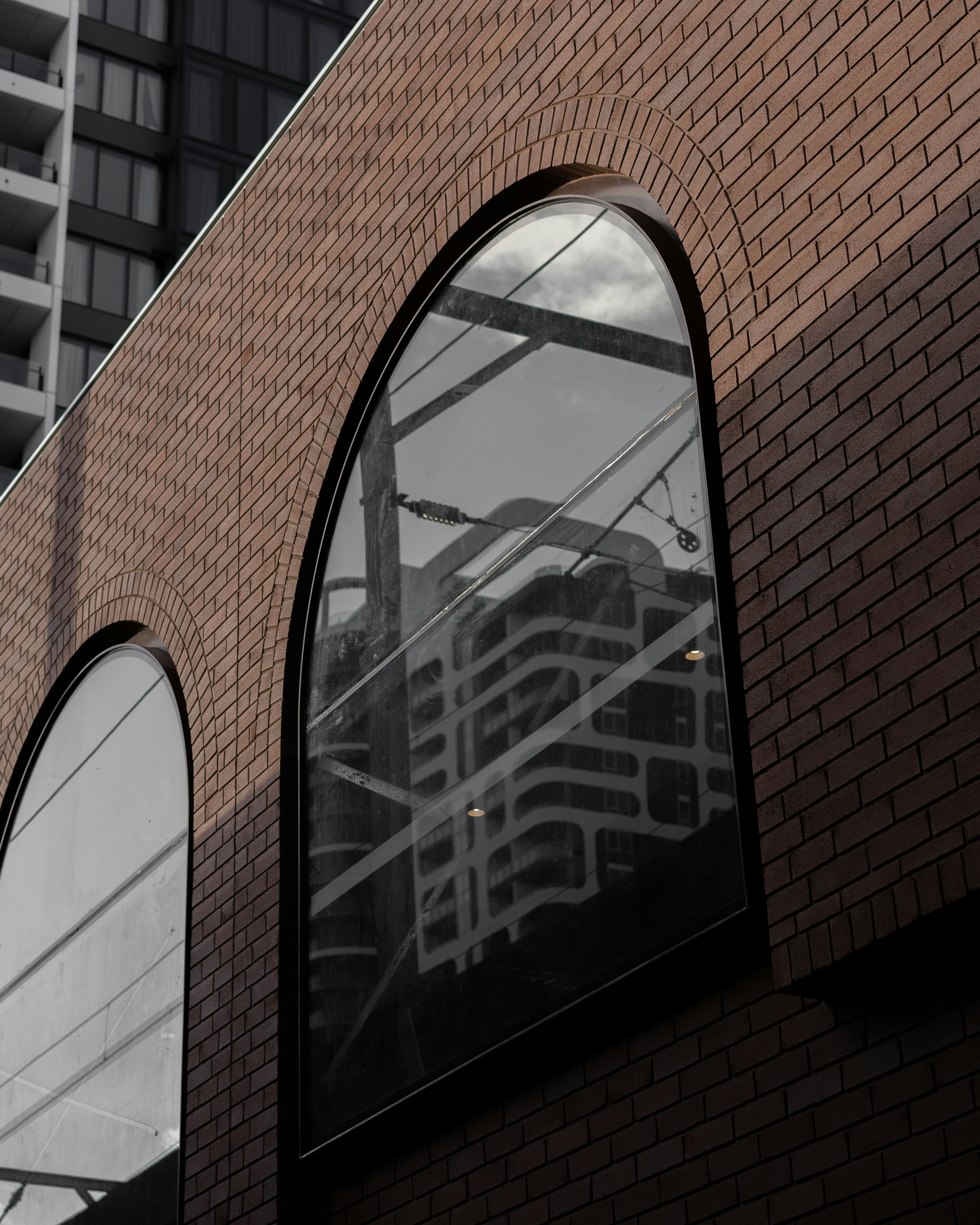 brown brick building with glass window