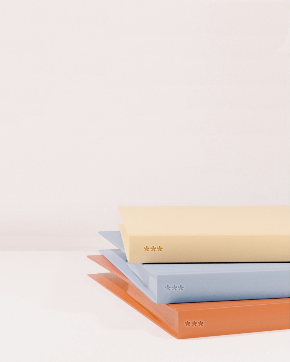 stack of books on white table