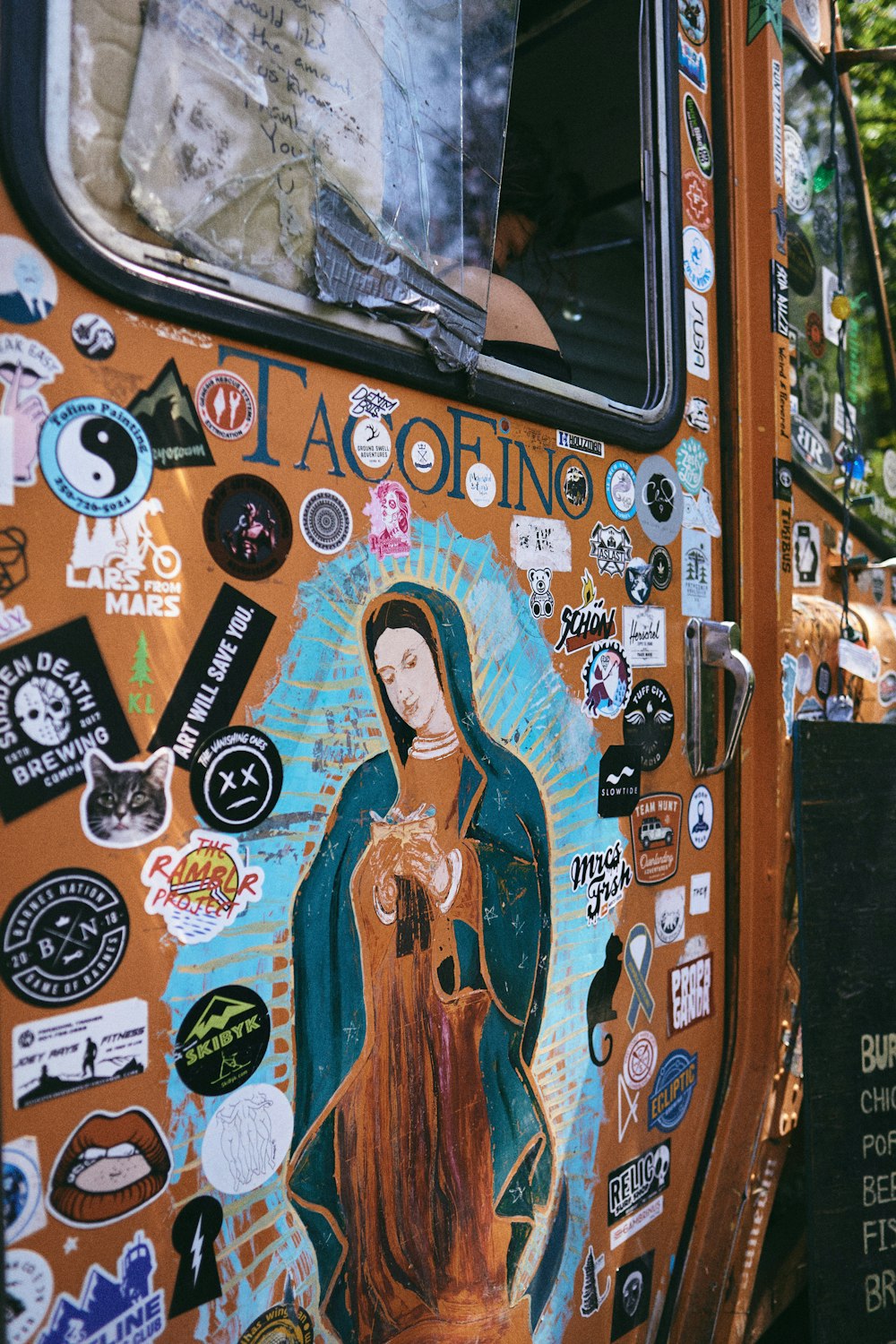 orange and white car with stickers