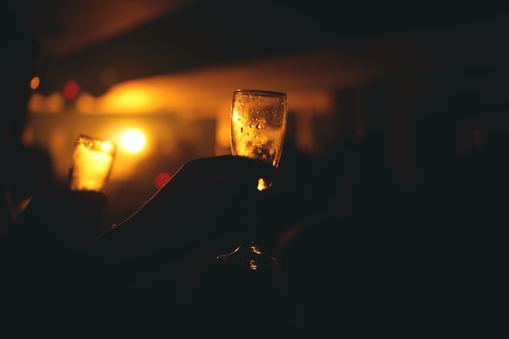 clear drinking glass with brown liquid inside