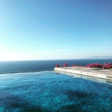 white and brown wooden dock on blue sea under blue sky during daytime