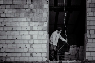 A professional electrician installing wiring in a home.
