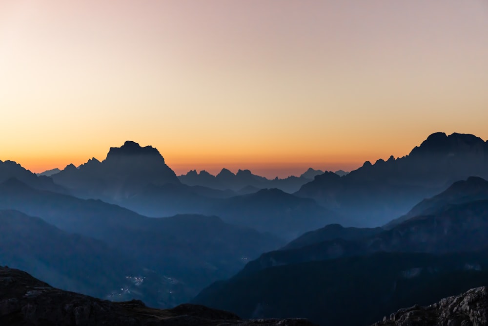 silhouette of mountains during sunset