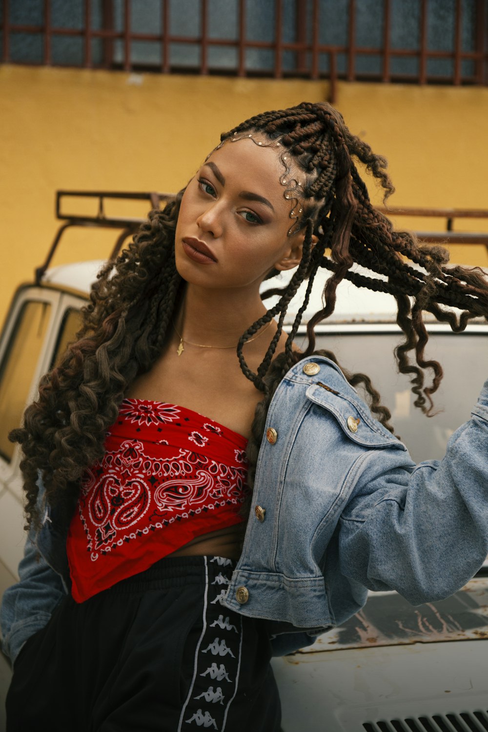 woman in blue denim jacket and red floral top