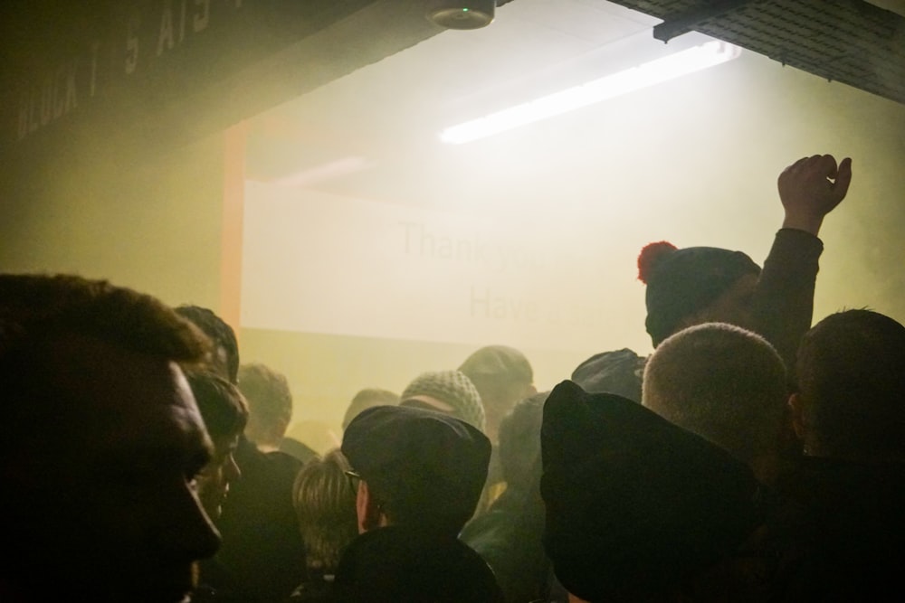 people standing in front of projector screen