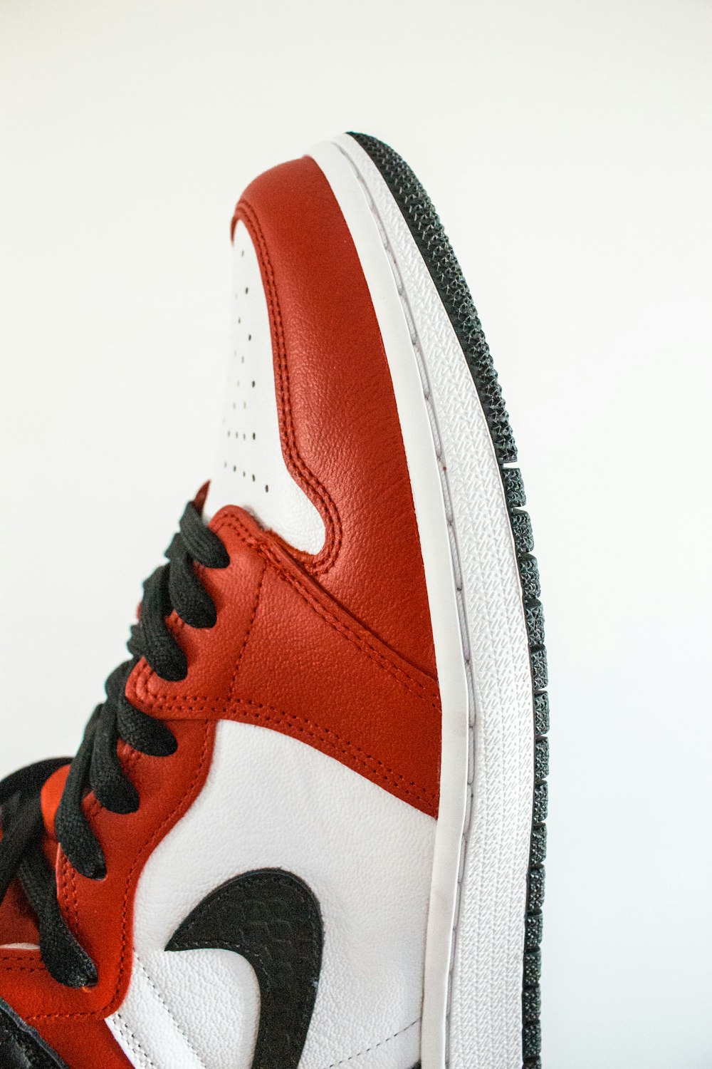 person wearing black and red nike air jordan 1 shoes photo – Free Image on  Unsplash