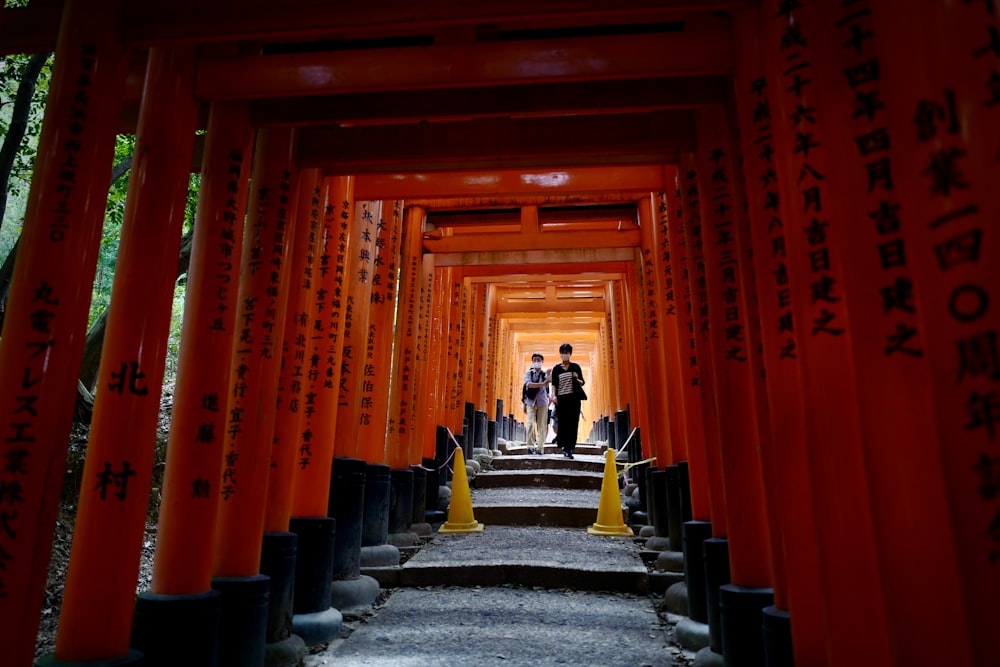 people walking on gray concrete stairs