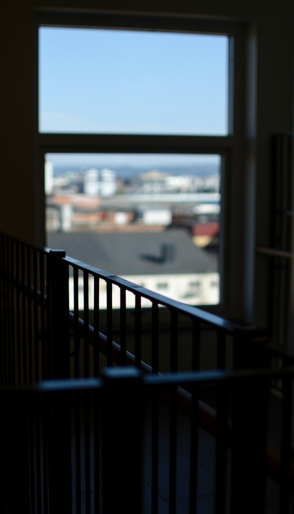 black metal railings near body of water during daytime