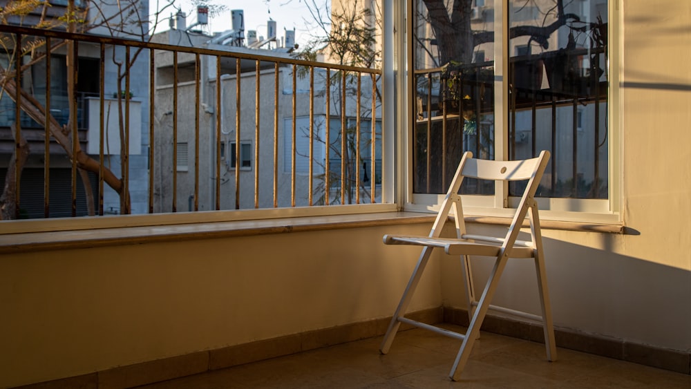 white wooden table beside window